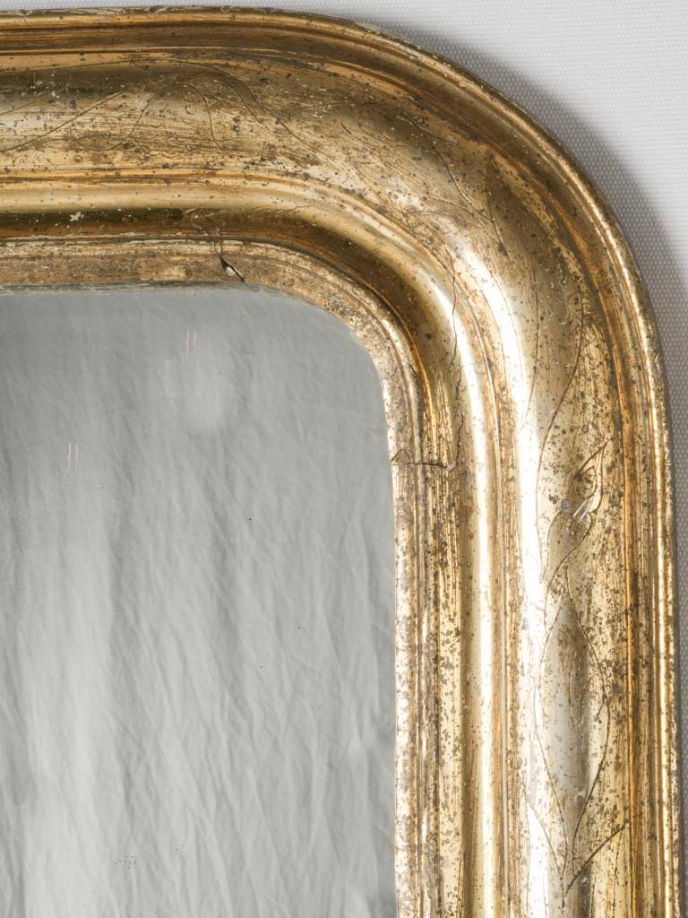 Whimsical, floral-detailed vintage mirror