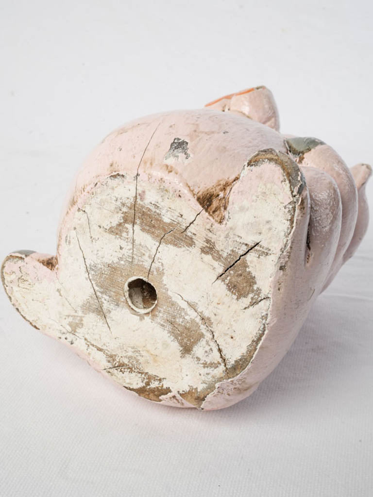 Expressive eyed wooden piglet sculpture