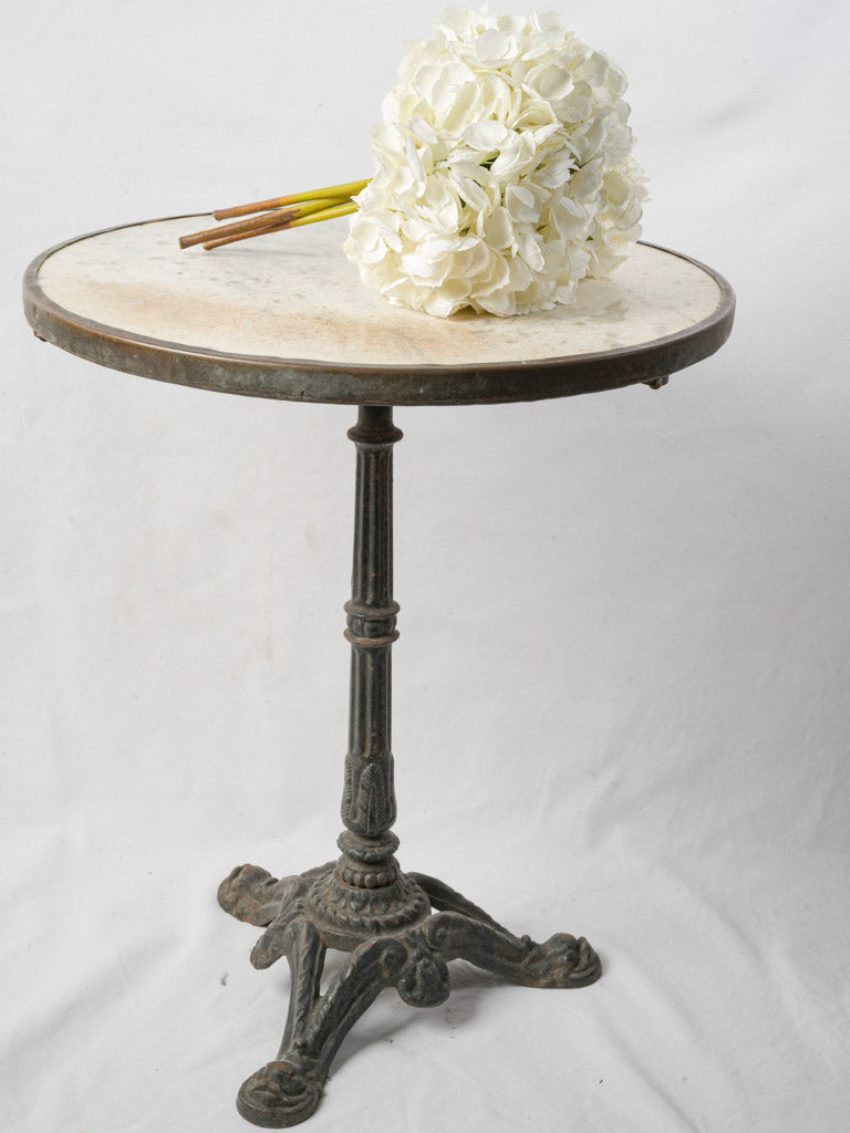 Timeless patinated marble top table
