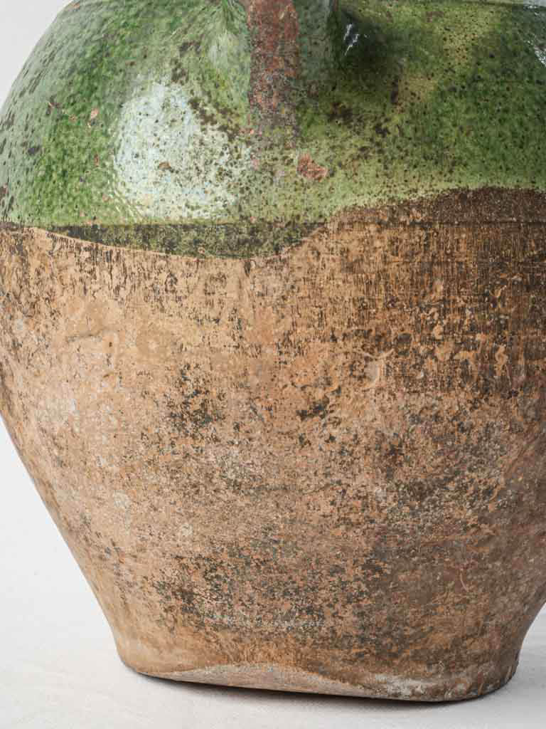Earthy unglazed antique pottery jug