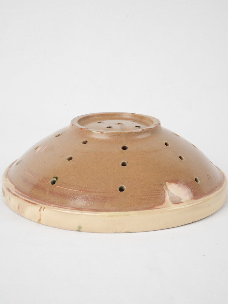 Charming old-world ceramic strainer piece