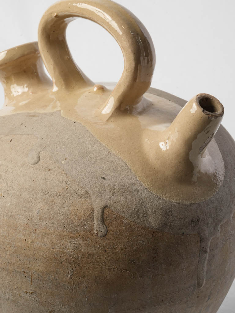 Antique cream-glazed stoneware jug