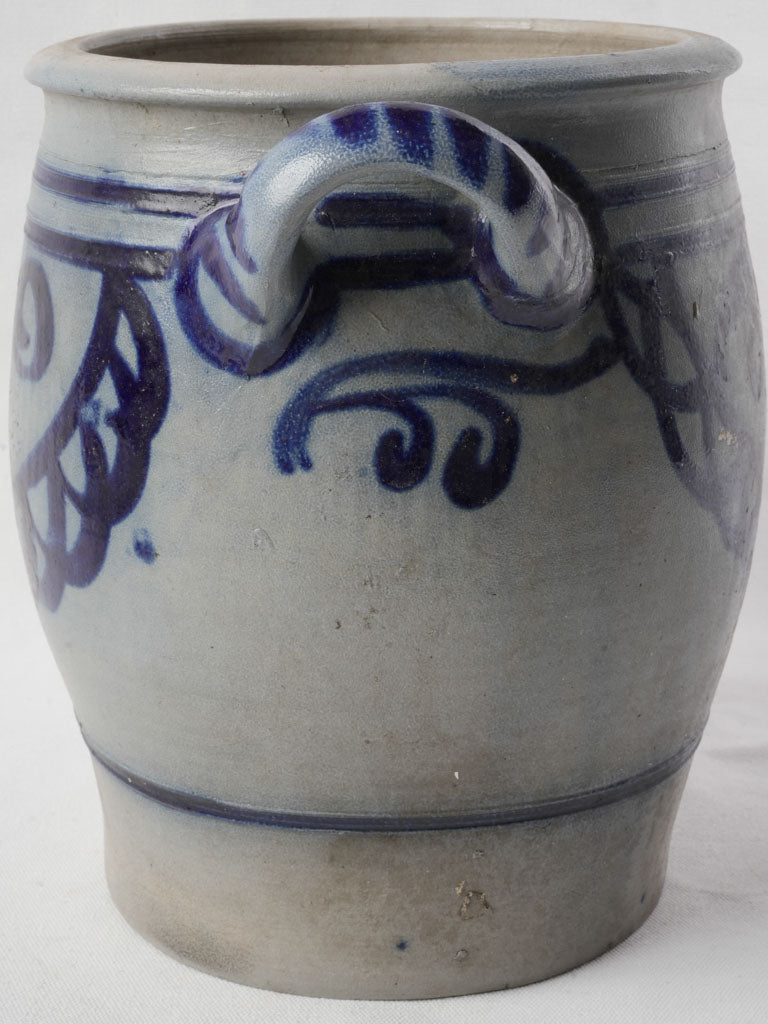 Handcrafted blue-accented pottery jar