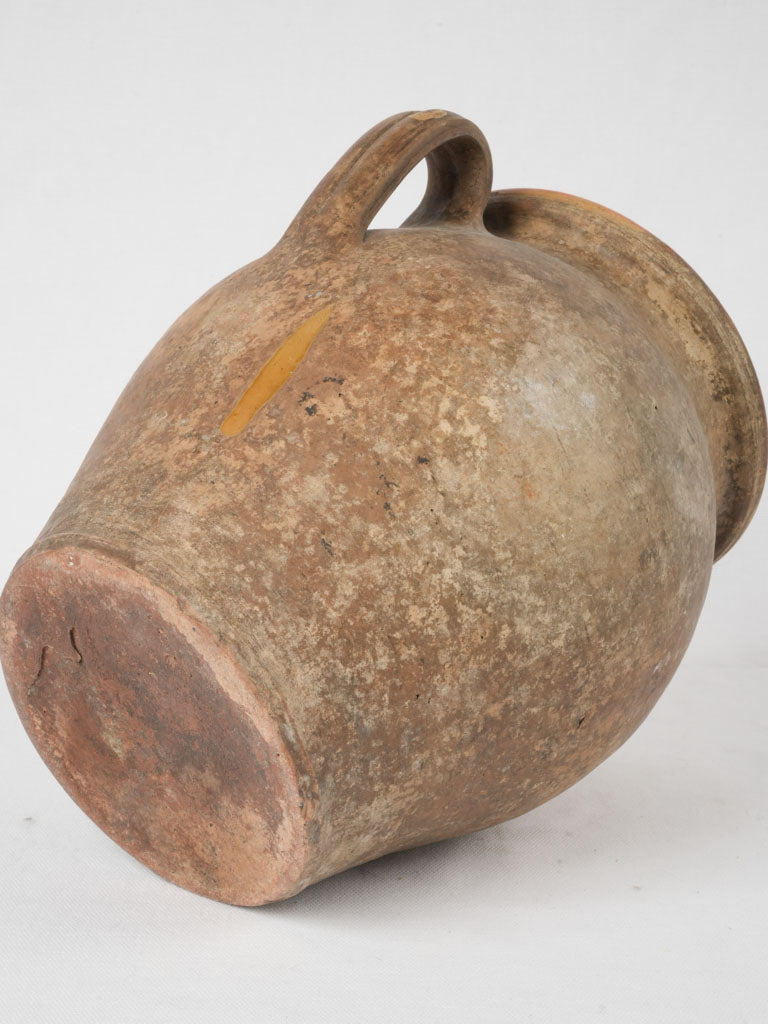 Tapered-base antique pottery with charm
