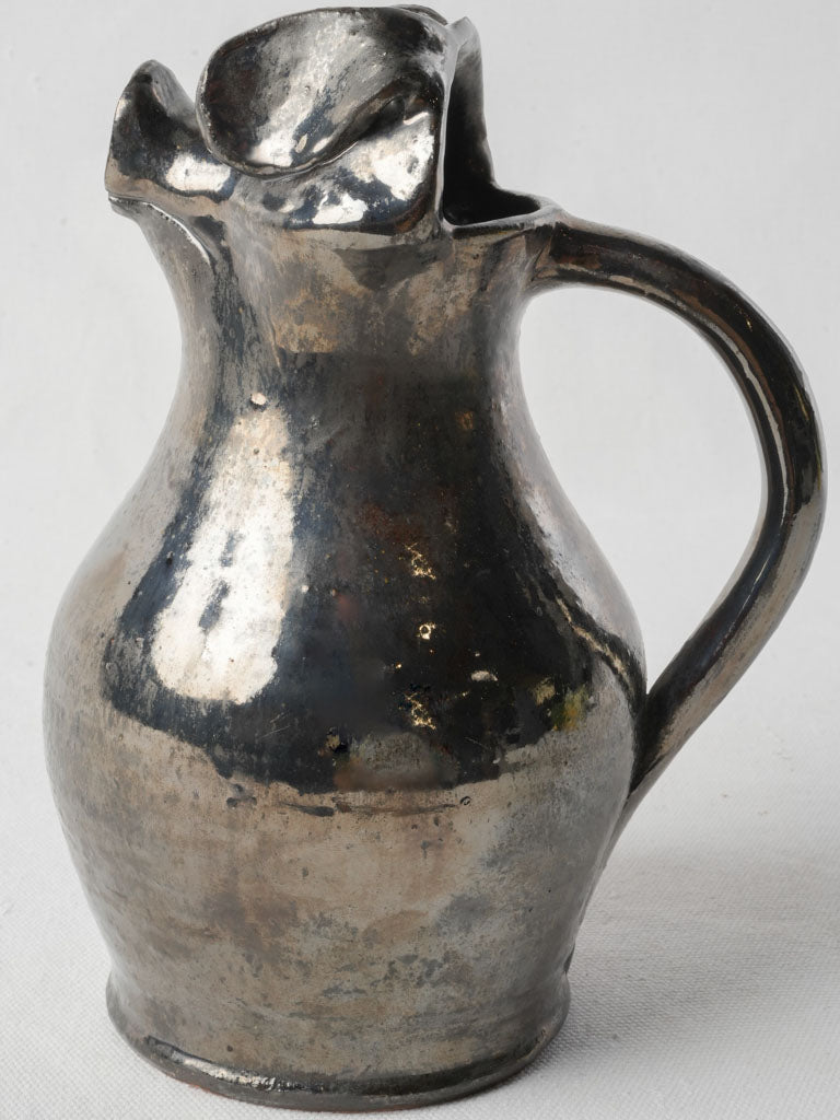 Unique sculpted enamel pitcher