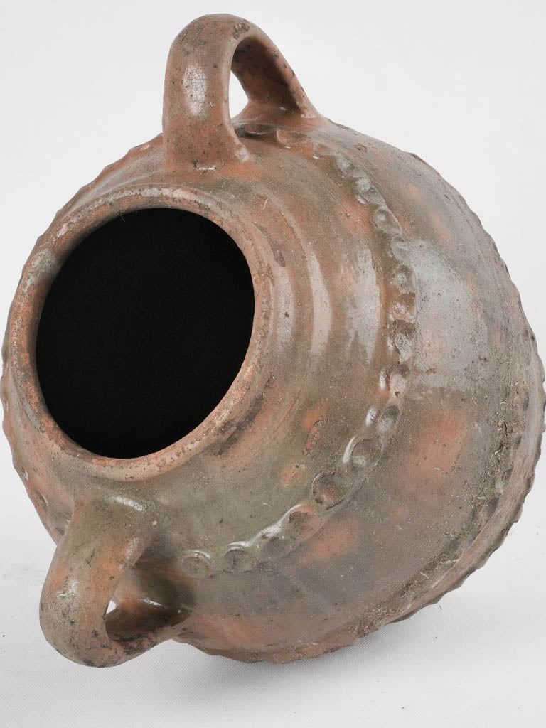 Distinctive finger-pressed walnut oil jar