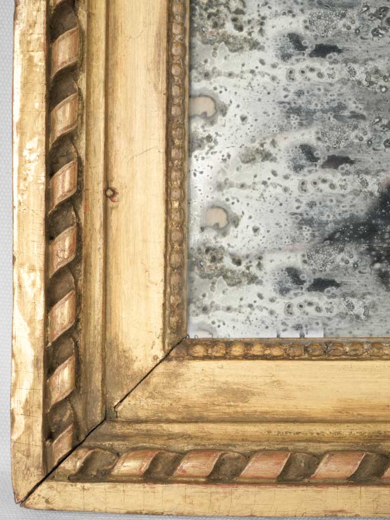 Ornate gold-finished Louis XVI mirror