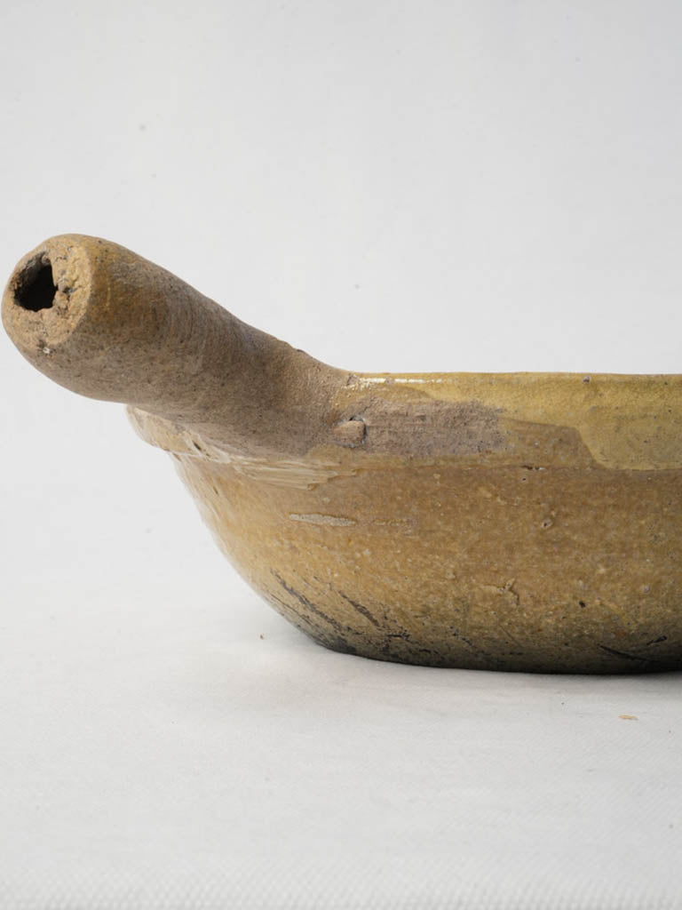 Timeworn terracotta cooking vessel