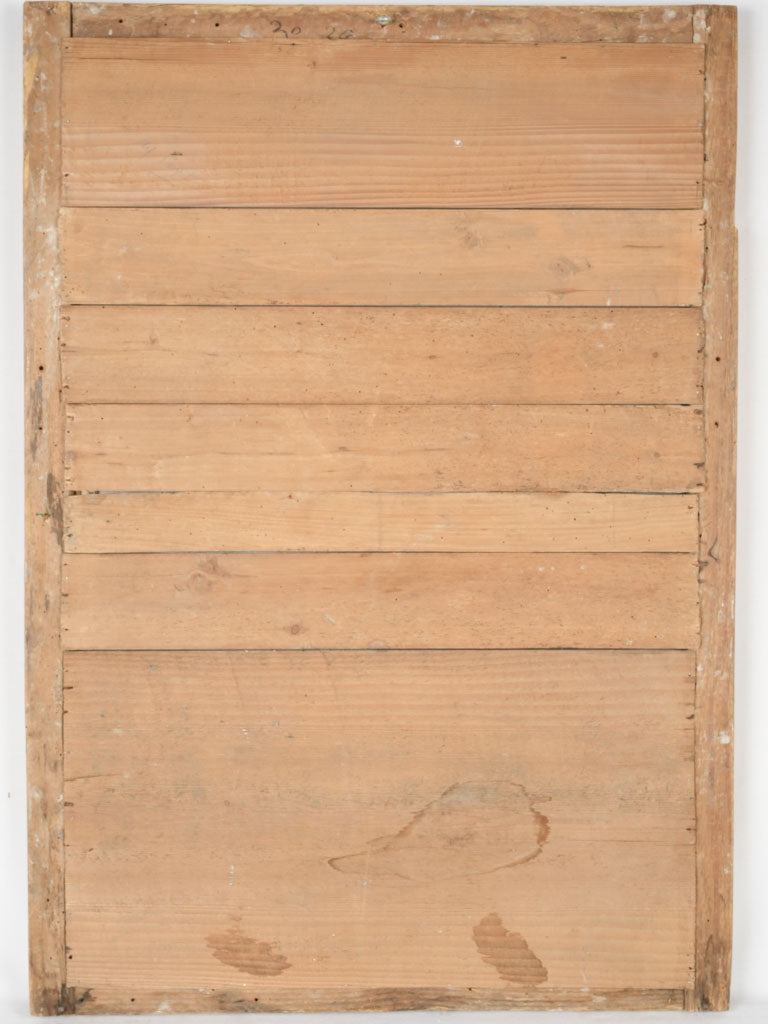 Aged pearl-framed gilded mirror