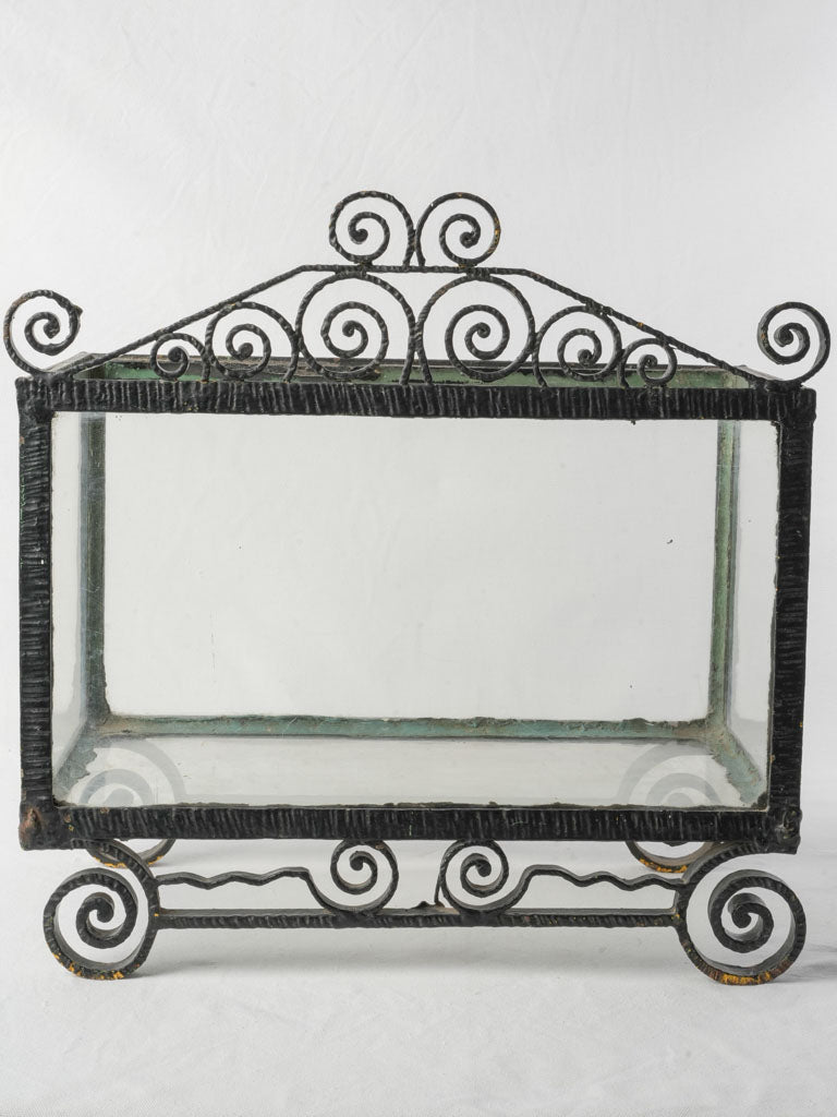 Elaborate wrought iron display case