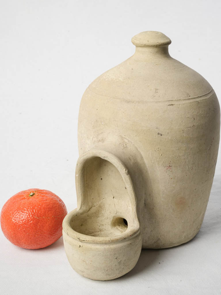 Charming unglazed white bird feeder