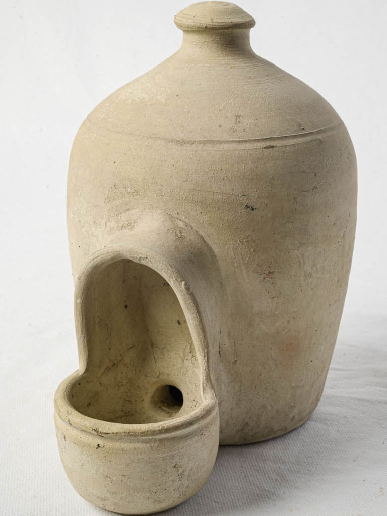 Handcrafted rustic terracotta bird waterer