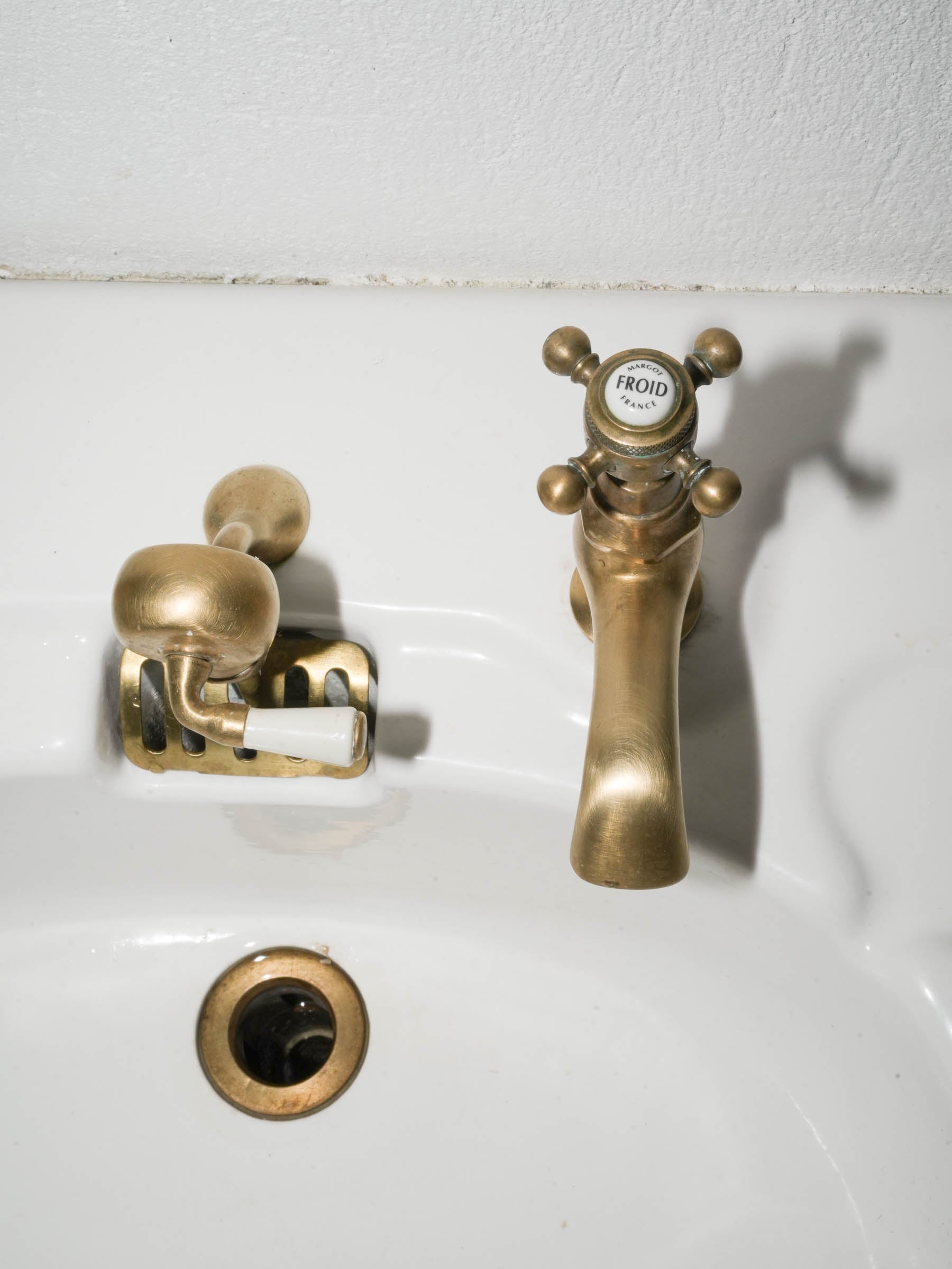 White Porcelain Wall-Mounted Washbasin with Brass Taps