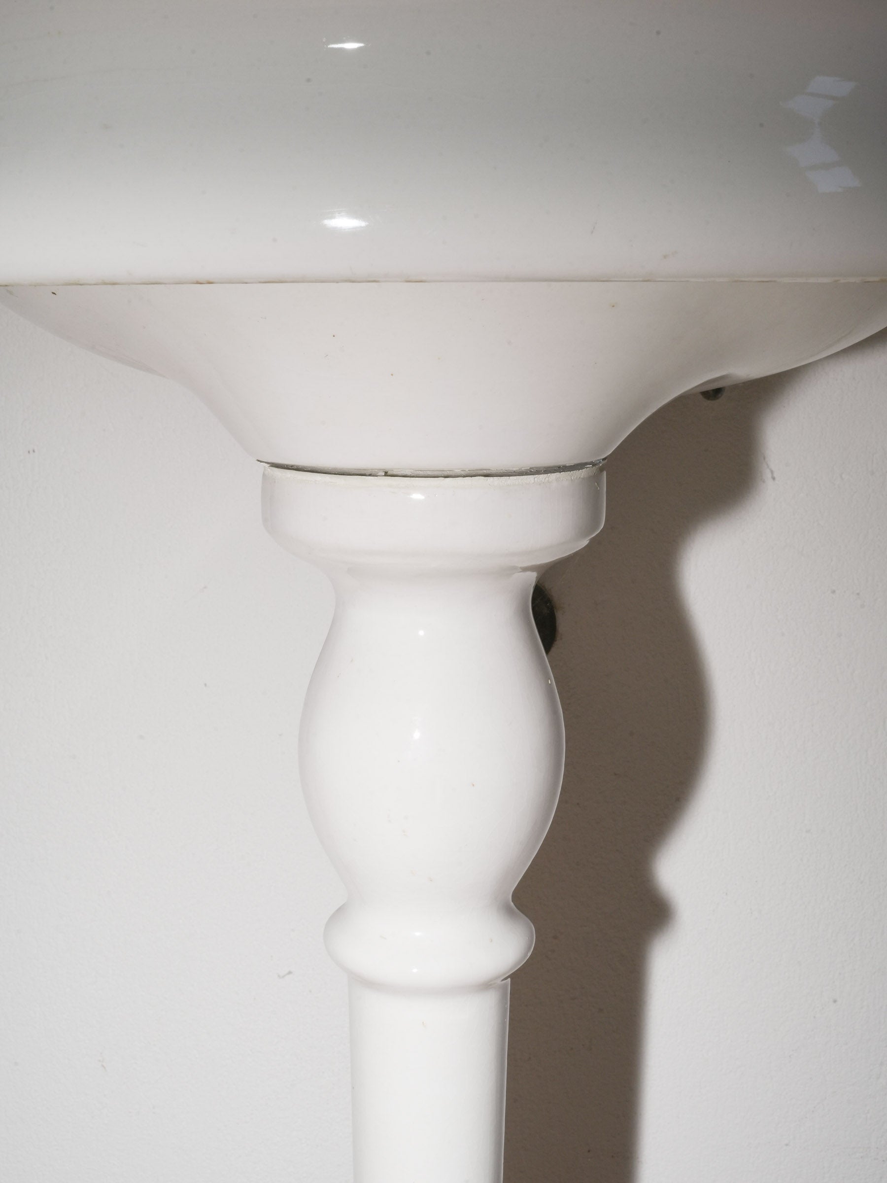 White Porcelain Wall-Mounted Washbasin with Brass Taps