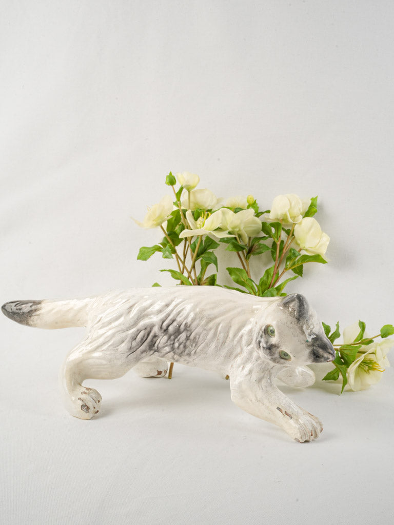 Weathered earthenware cat sculpture