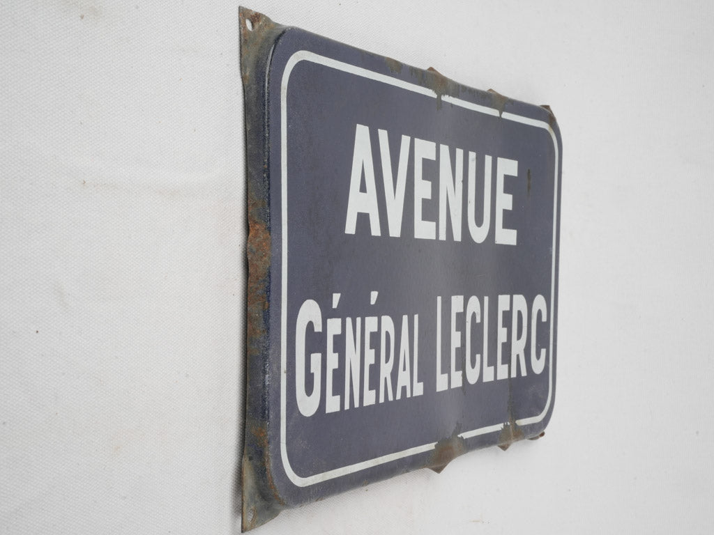 Weathered navy-white Parisian street sign