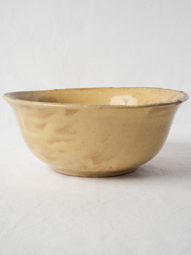 Aged yellow glazed serving bowl