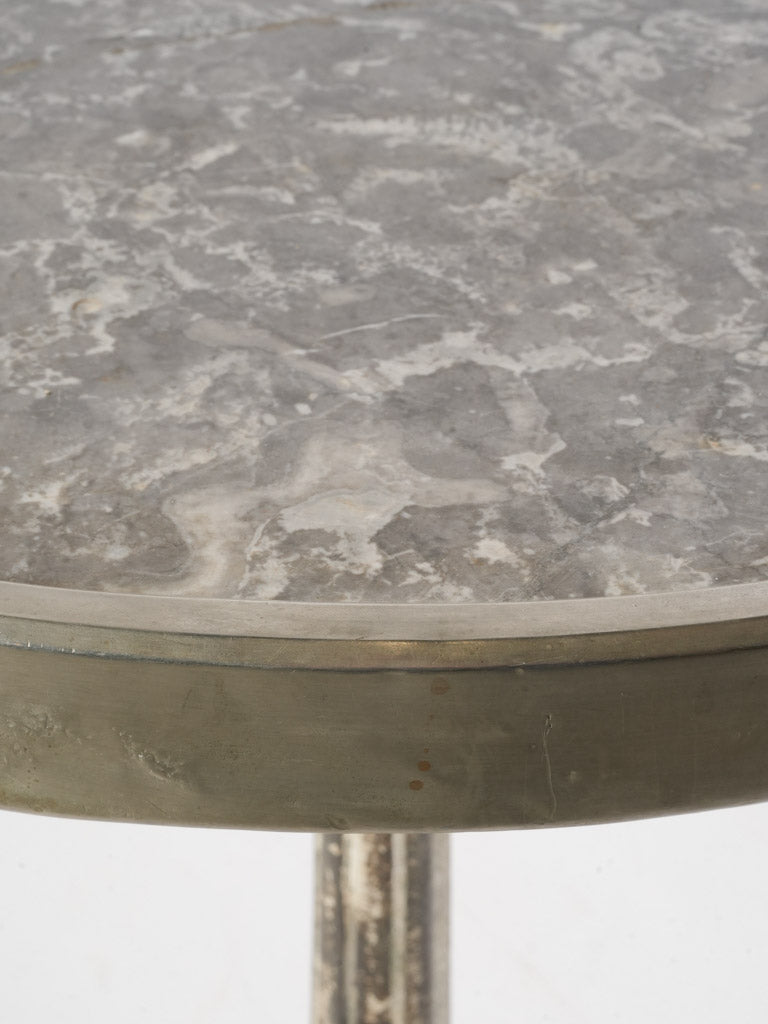 Nickel-silver rimmed marble table