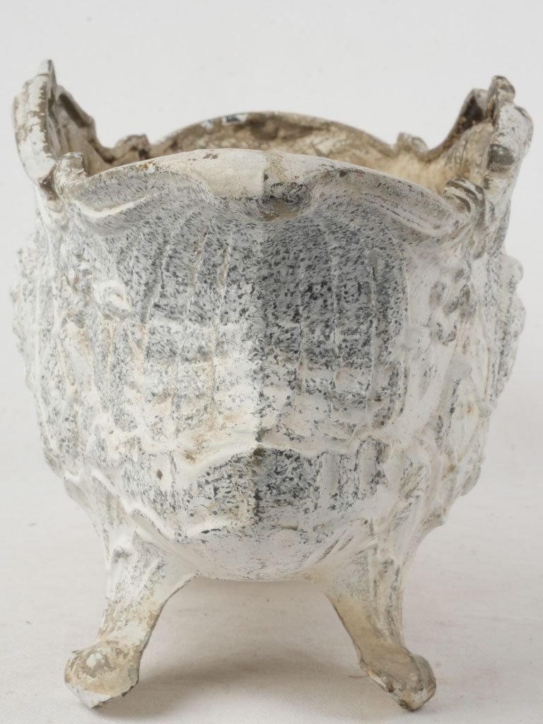 Graceful scrolling iron jardinière