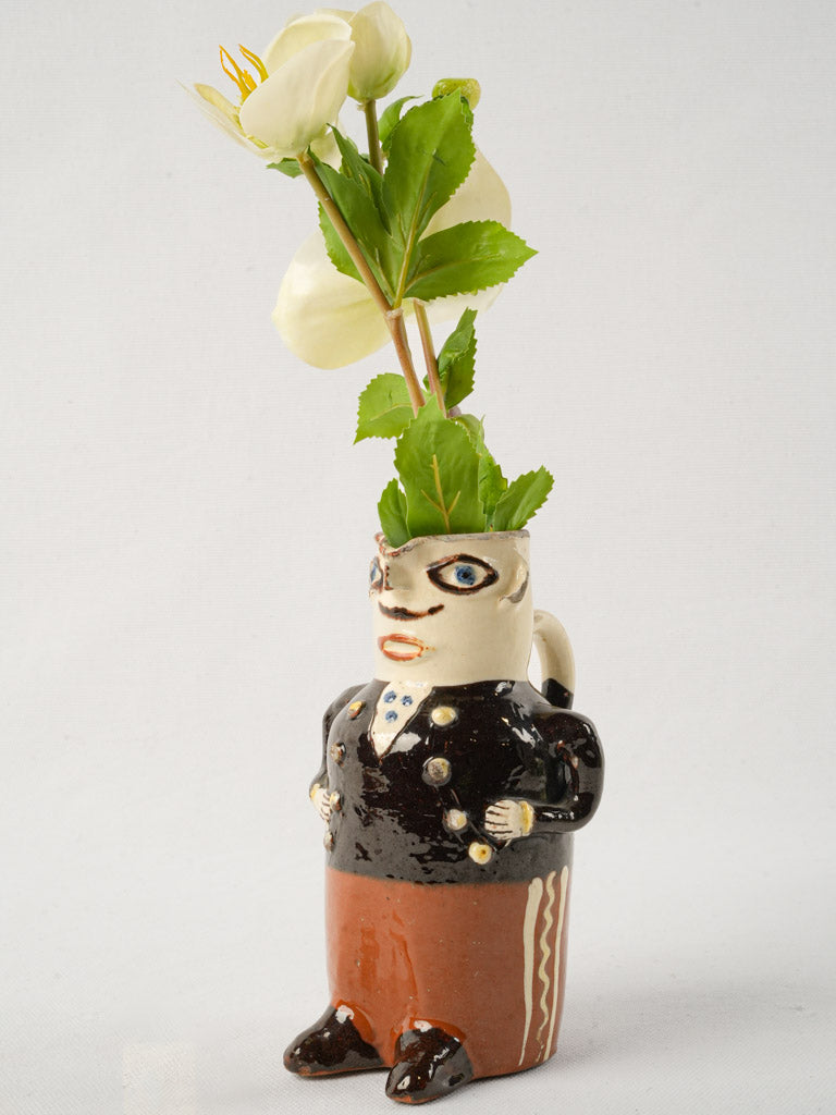 Whimsical glazed terracotta character jug