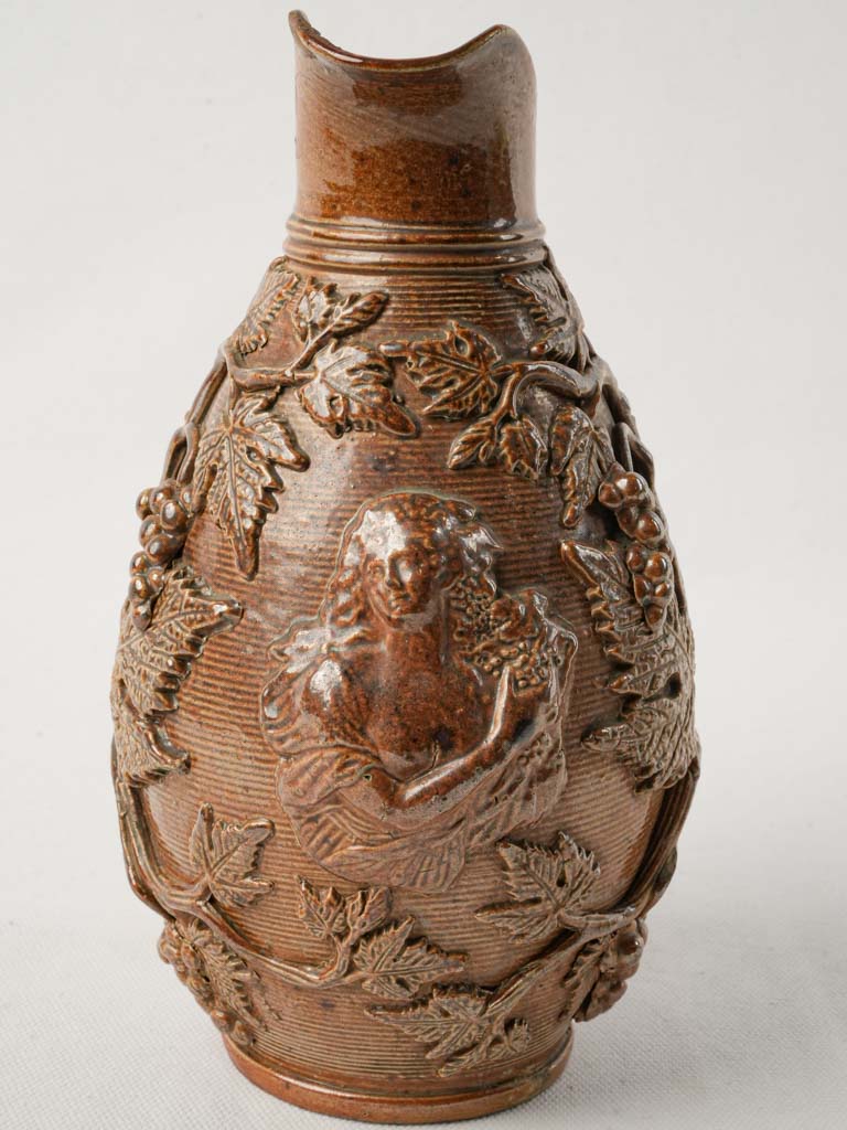Intricate grape vine motif pitcher