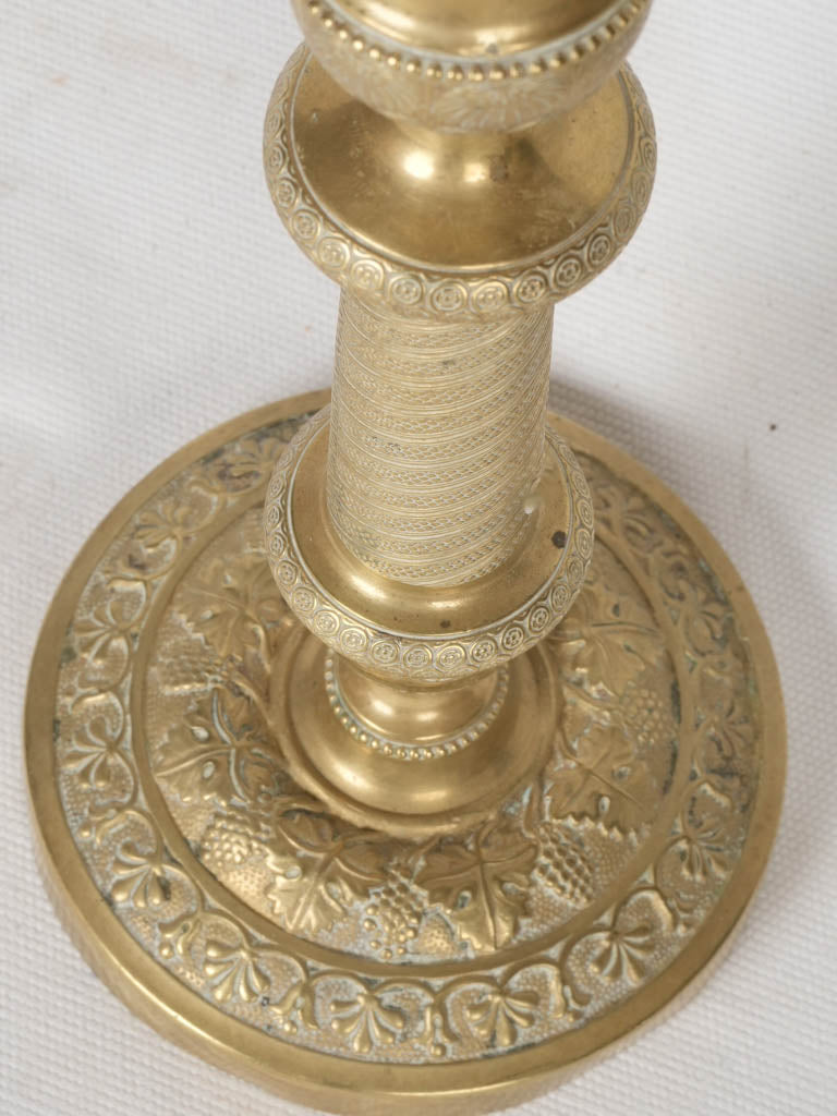Intricate bronze triple-light candelabras