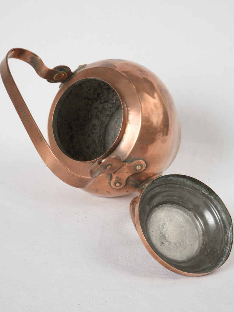 Well-fitted lid ornate copper kettle