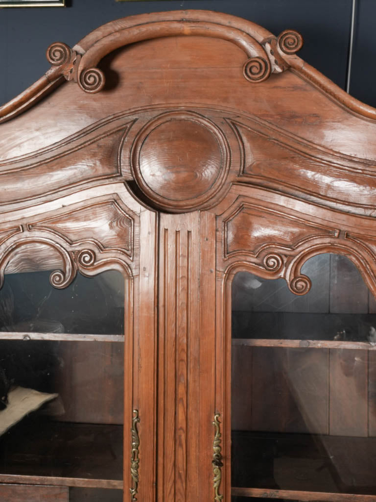 Warm-toned antique cupboard vitrine