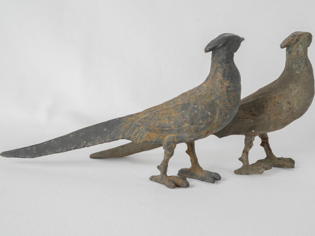 Patina-covered cast iron garden birds