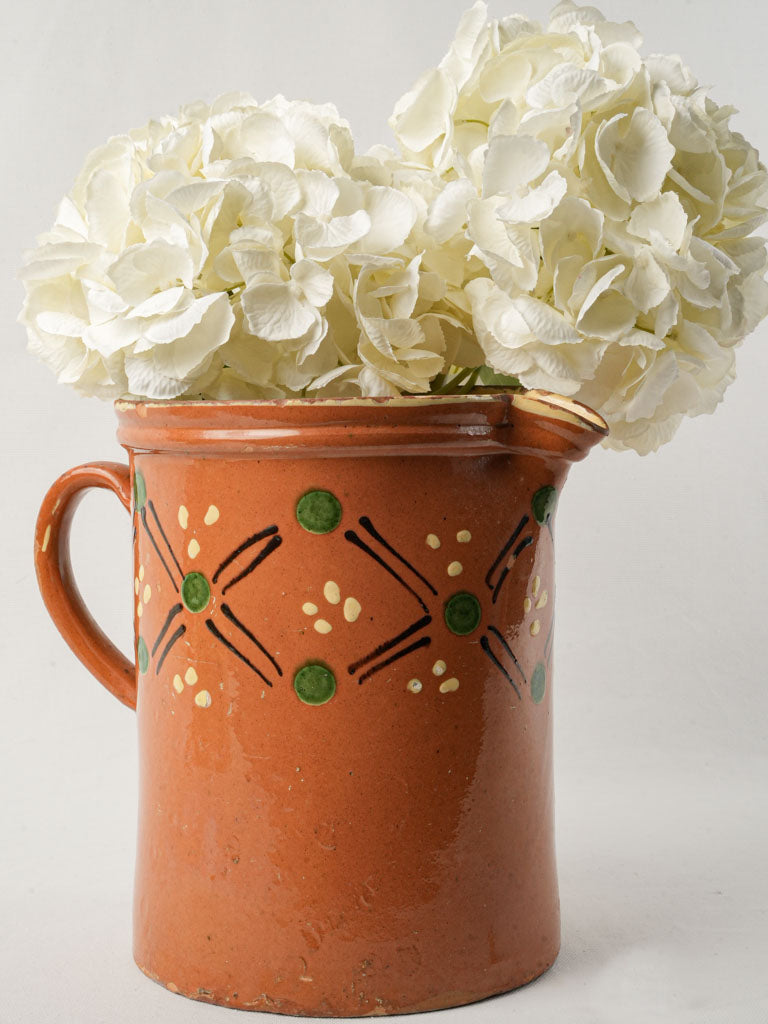 Rustic vintage terracotta milk pitcher