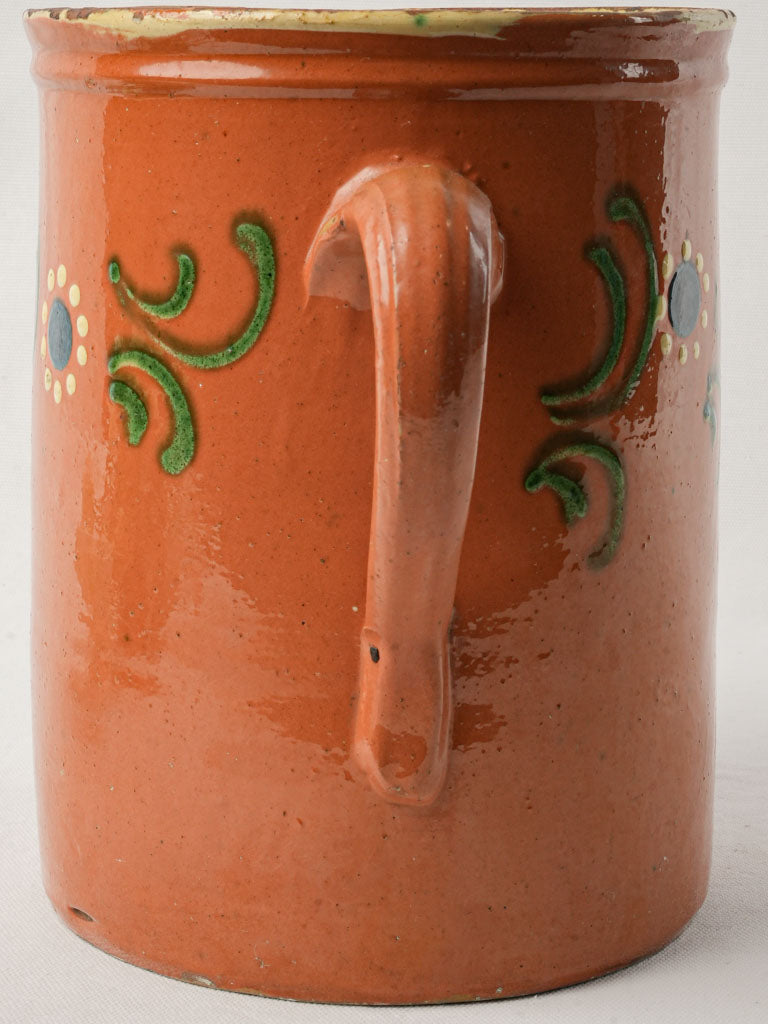 Decorative ocher-glazed ceramic pitcher