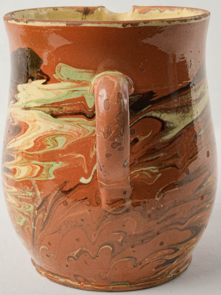 Artistic brown ocher pitcher