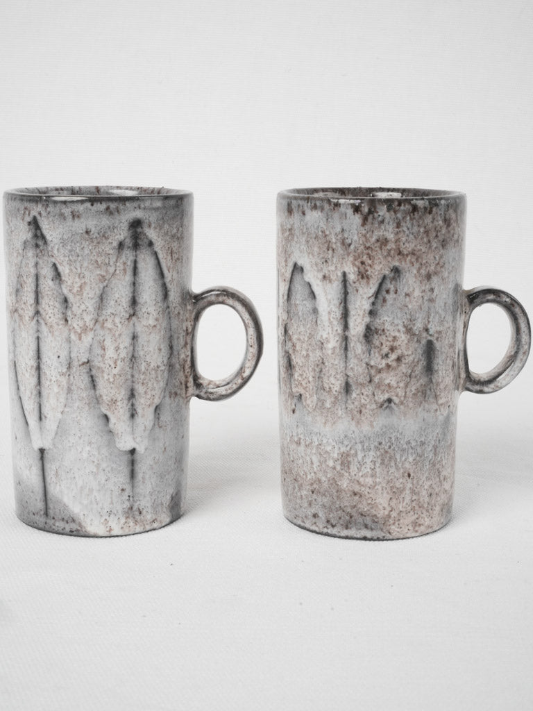 Elegant tall cylindrical coffee mugs