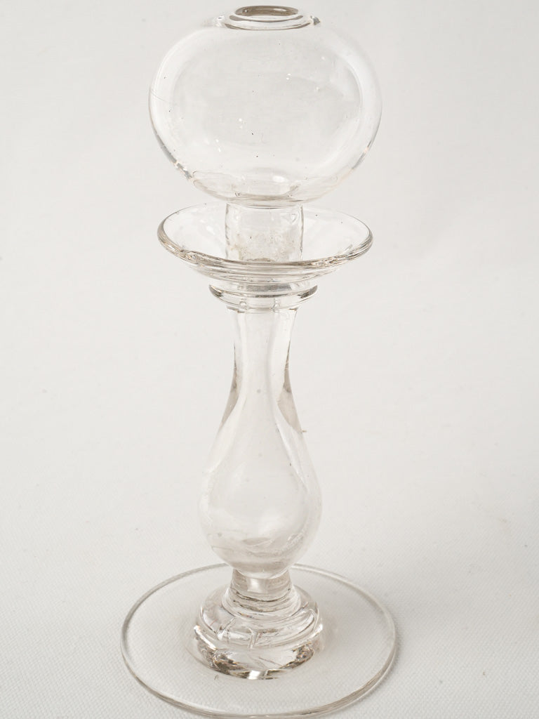 Delicate bulbous reservoir lamp