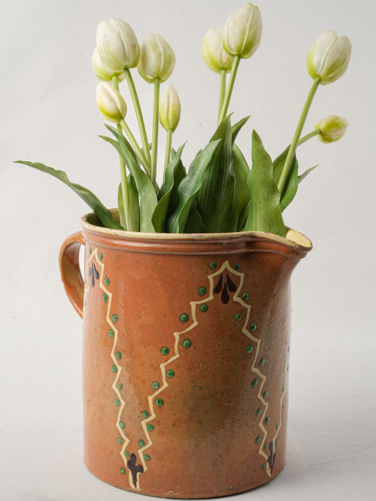 Antique vibrant terracotta pitcher