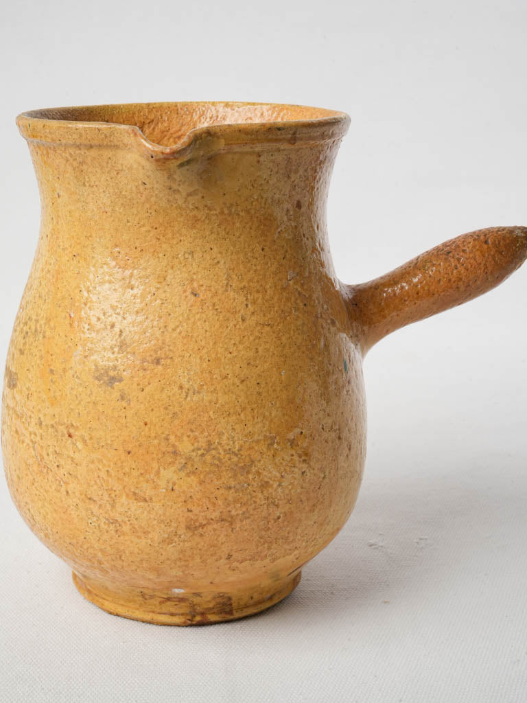 Vintage lemon-yellow ceramic pitcher