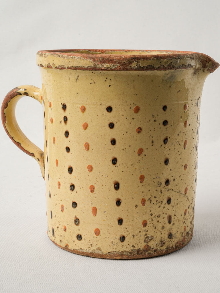 Weathered decorative milk vessel