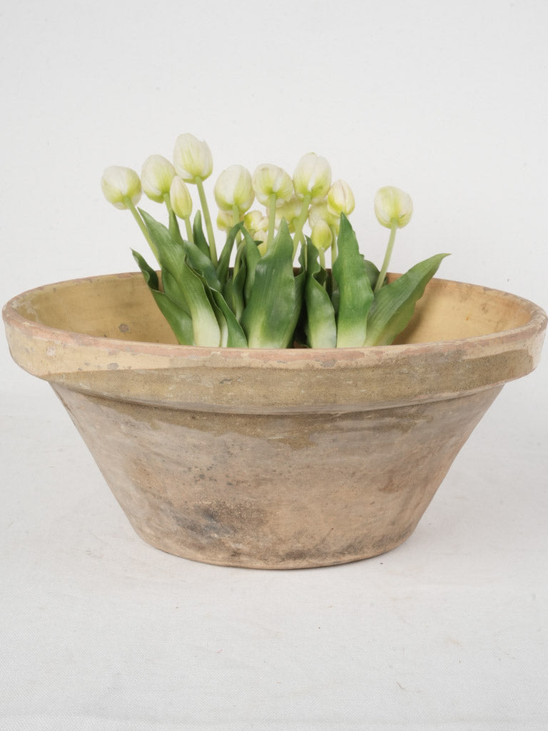 Rustic yellow-glazed pottery bowl