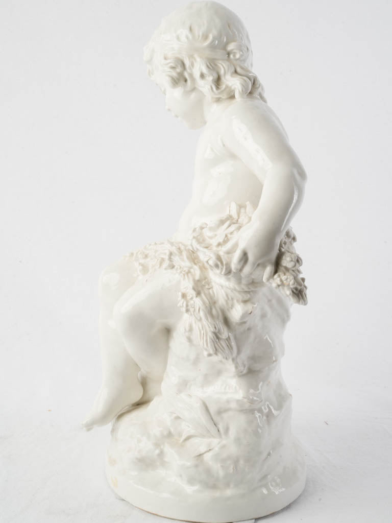 Intricate floral porcelain cherub ornament