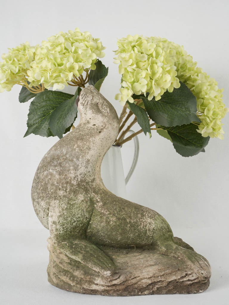 Weathered 1950s garden decor seal