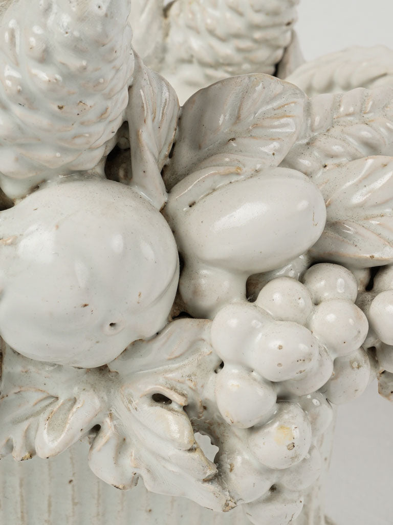 Antique pinecone and grape sculpture