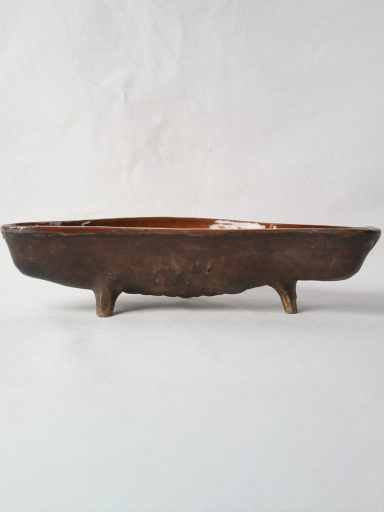 Brown glazed earthenware fish mold