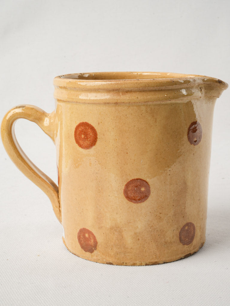 Warm hued antique pottery pitcher