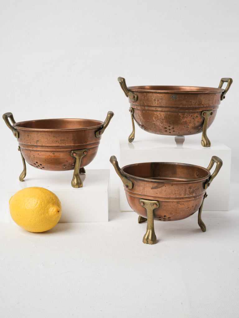 Patinated brass-footed kitchenware collection