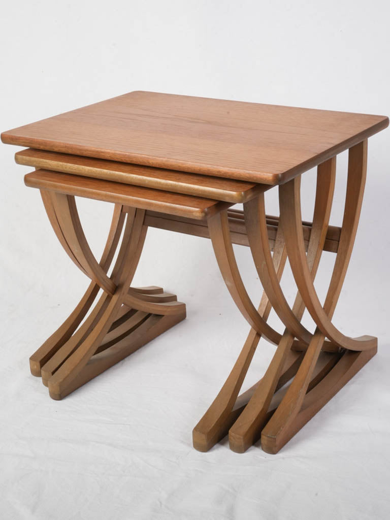 Graceful rhythm curved nesting tables