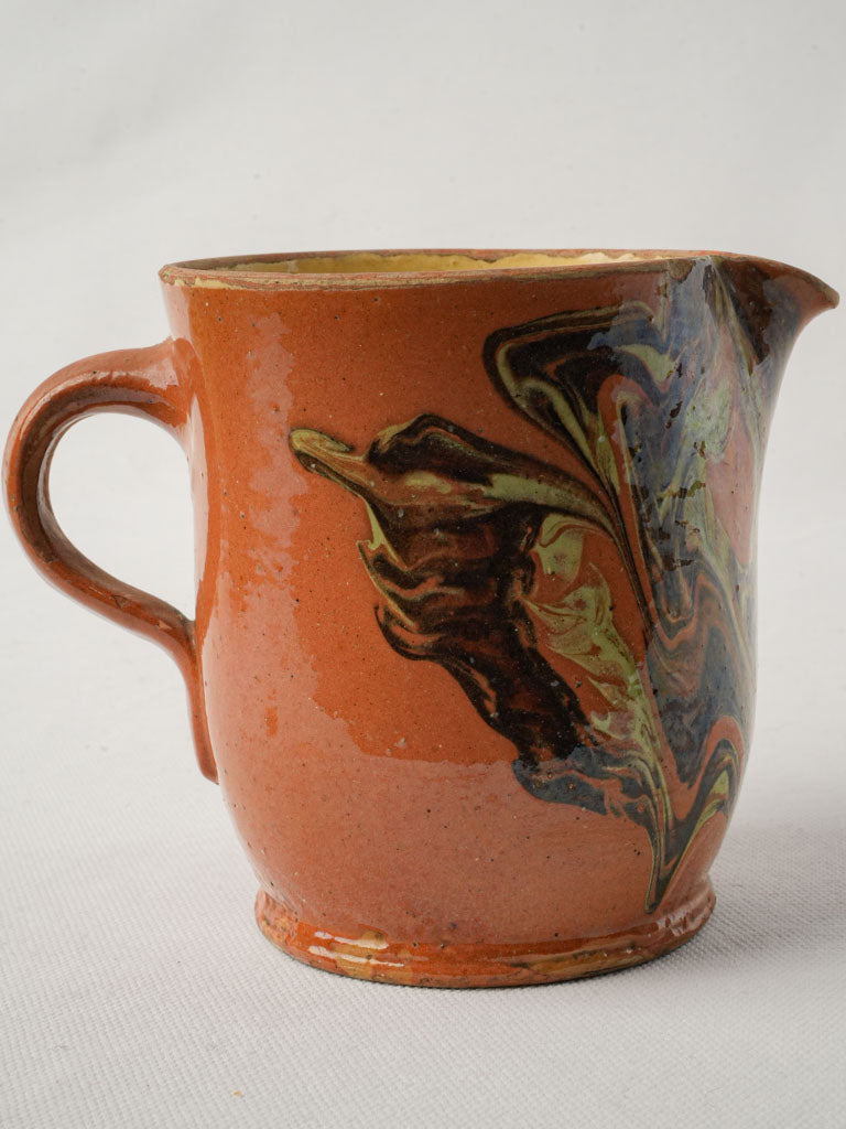 Elegant jaspe-patterned vintage pitcher