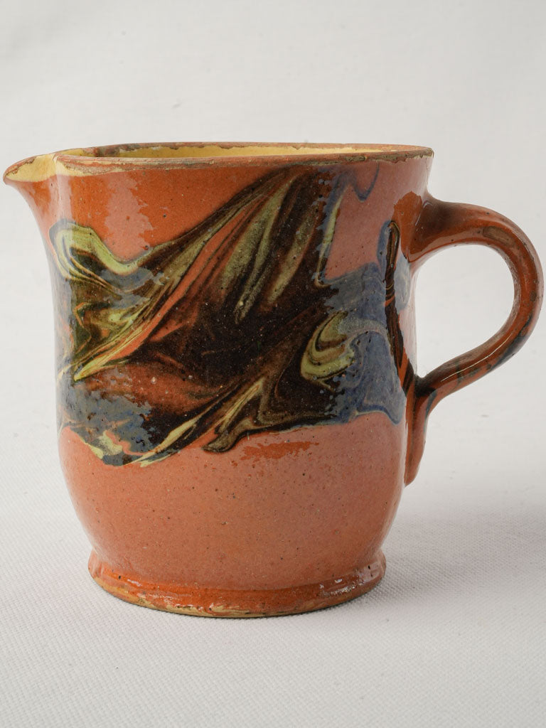 Colorful 19th-century ceramic pitcher