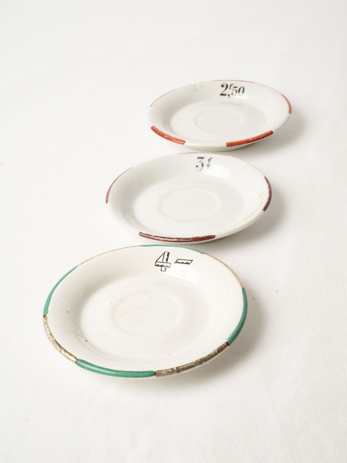 Three Vintage French Bistro Porcelain Saucers 5"