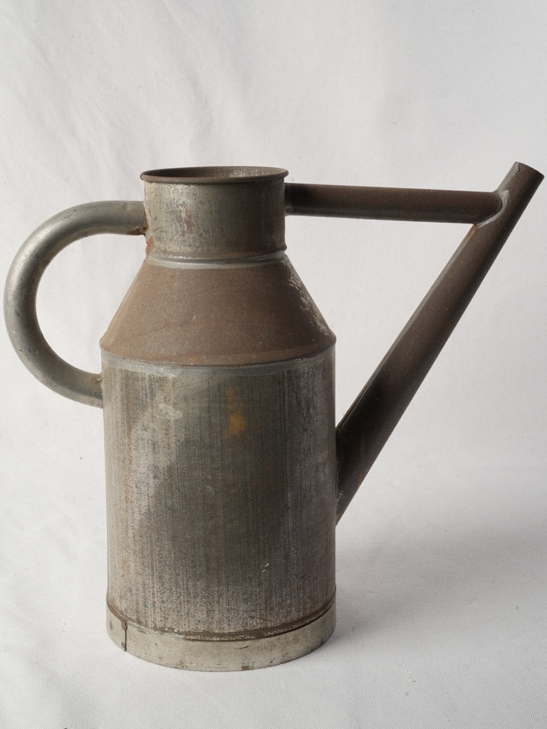 Patina-coated antique winemaker's can