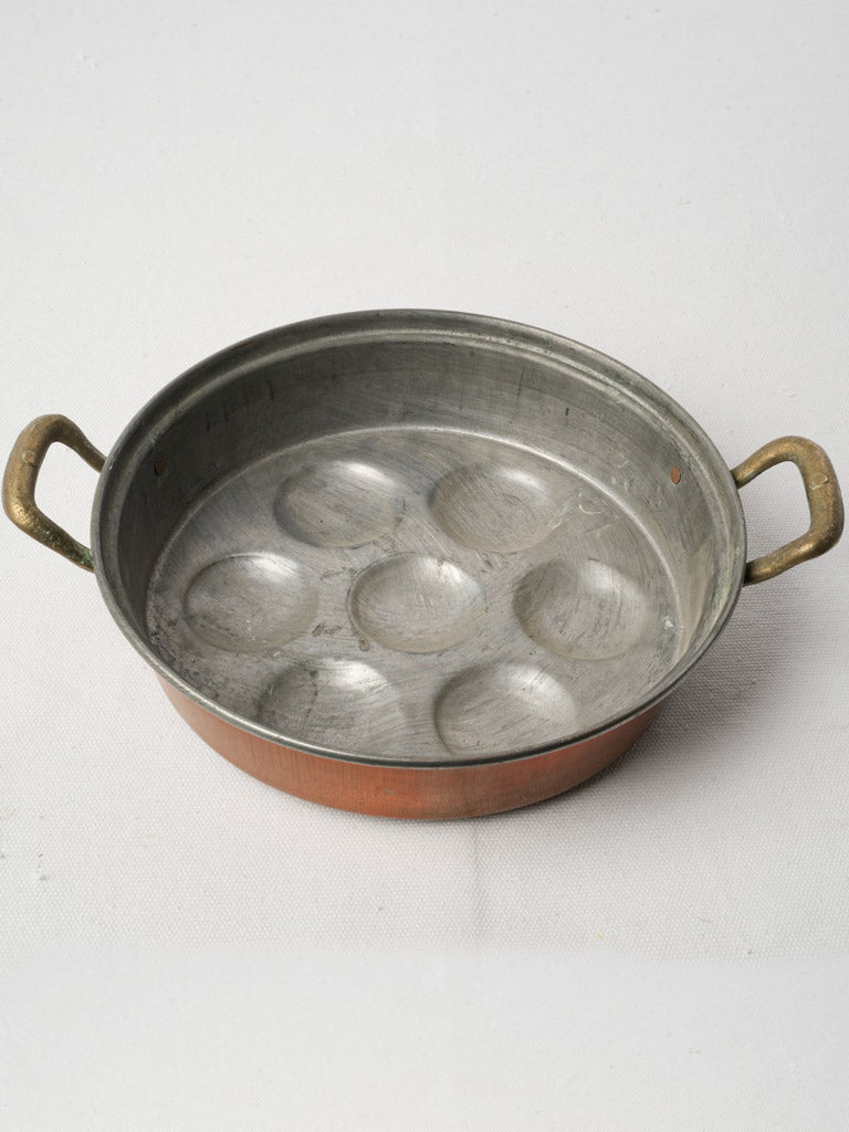 Antique rounded copper egg poacher